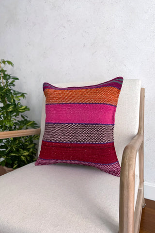 Cojín peruano étnico naranja y rosa